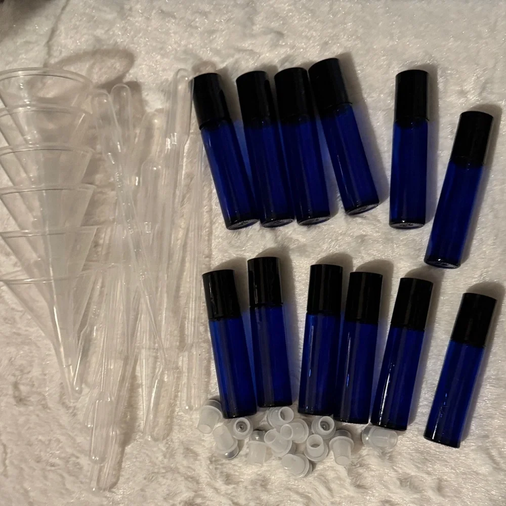 Pink and Black Travel Case with 12 Blue Roll On Bottles with Funnels Pipettes